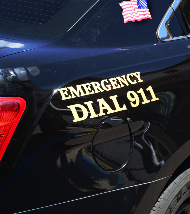 SANTA FE, NM - JULY 27, 2017:  A Santa Fe, New Mexico, police car is marked with 'Emergency Dial 911' painted on its side. (Photo by Robert Alexander/Getty Images)