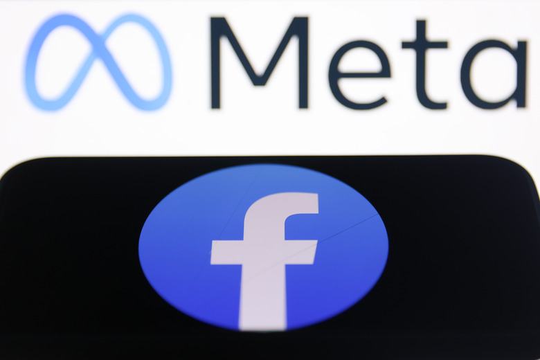 Meta logo displayed on a laptop screen and Facebook logo displayed on a phone screen are seen in this illustration photo taken in Krakow, Poland on July 31, 2024. (Photo by Jakub Porzycki/NurPhoto via Getty Images)
