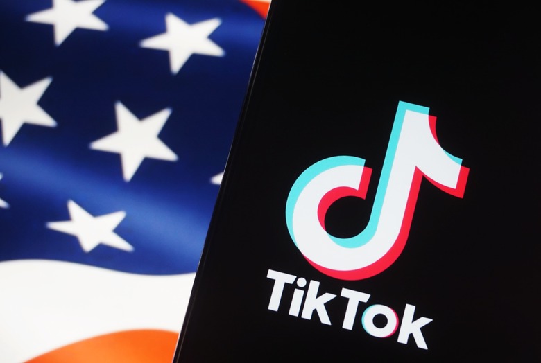 HANGZHOU, CHINA - MAY 08 2024: A setup image of a phone screen showing TikTok and a screen showing Stars and Stripes. (Photo credit should read LONG WEI / Feature China/Future Publishing via Getty Images)