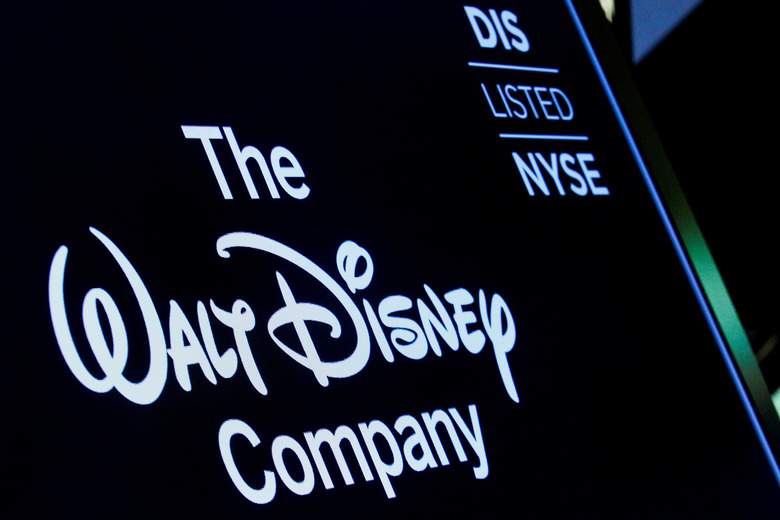 FILE PHOTO: A screen shows the logo and a ticker symbol for The Walt Disney Company on the floor of the New York Stock Exchange (NYSE) in New York, U.S., December 14, 2017. REUTERS/Brendan McDermid/File Photo