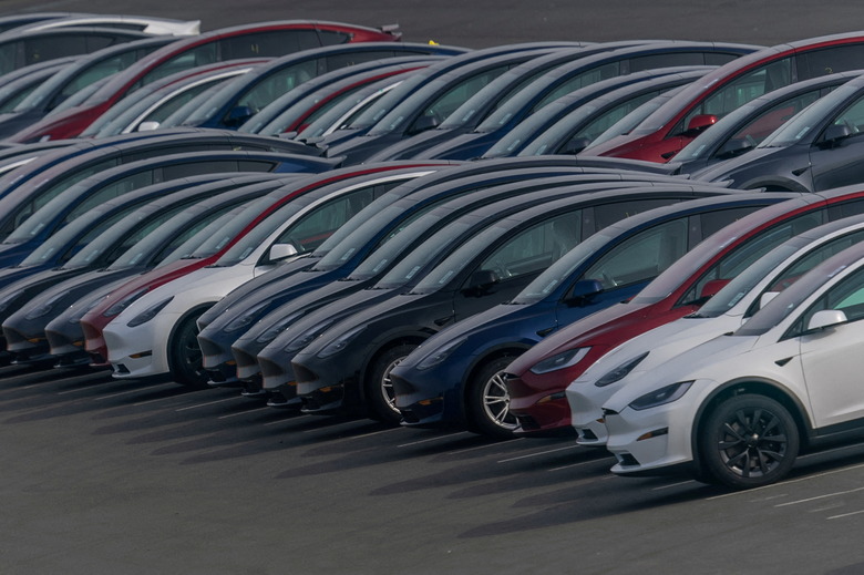 Tesla vehicles are parked at a parking lot as the company is recalling over 2 million vehicles in the U.S. to install new safeguards in its Autopilot advanced driver-assistance system, after a federal safety regulator cited safety concerns, in Richmond, California, U.S. December 14, 2023. REUTERS/Carlos Barria     TPX IMAGES OF THE DAY