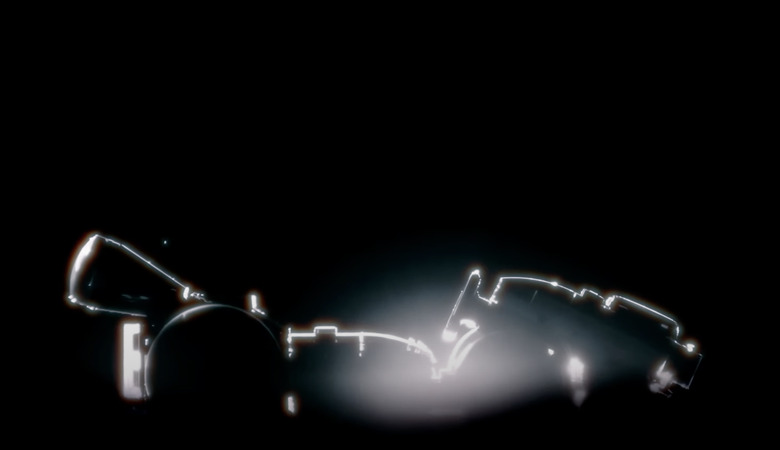 The illuminated outline of a Mario Kart kart is shown against a black background