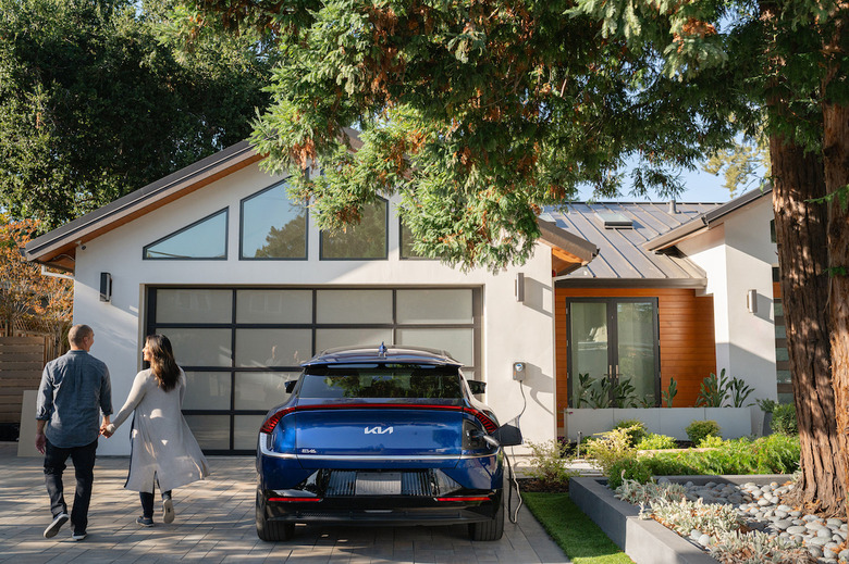 A house with an EV charger in front. 