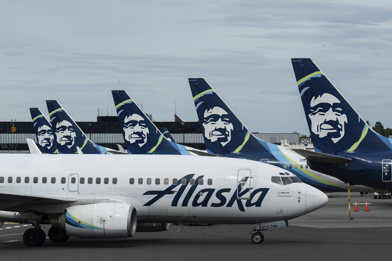 Alaska Airlines planes are seen at the Ted Stevens Anchorage International Airport in Anchorage, Alaska, Saturday, Aug. 16, 2025. (AP Photo/Jae C. Hong)