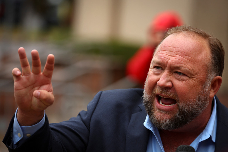 Infowars founder Alex Jones speaks to the media after appearing at his Sandy Hook defamation trial at Connecticut Superior Court in Waterbury, Connecticut, U.S., October 4, 2022. REUTERS/Mike Segar