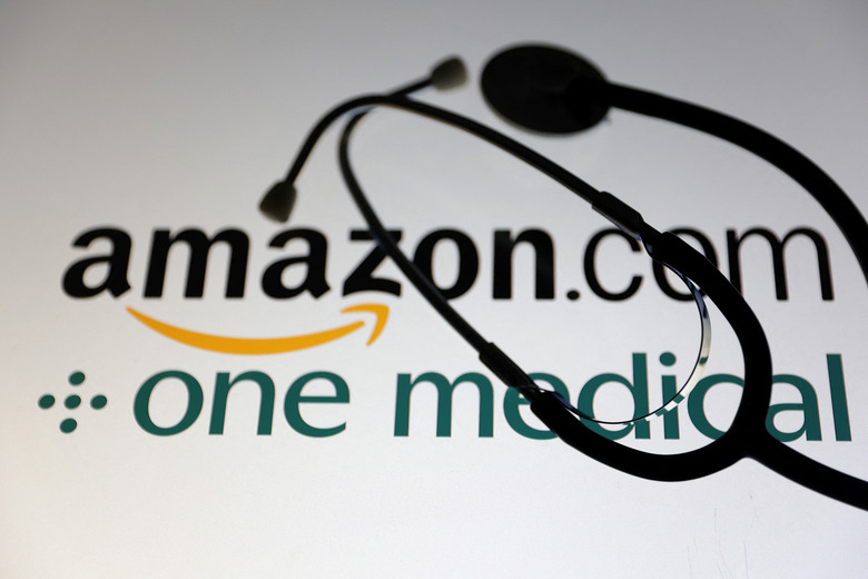 A stethoscope is placed on displayed Amazon.com and One Medical logos in this illustration taken July 26, 2022. REUTERS/Dado Ruvic/Illustration