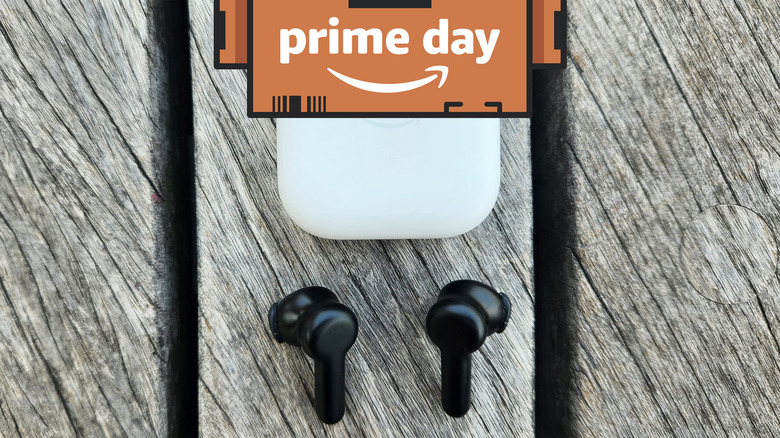 Echo Buds outside their charging case on a wood table.