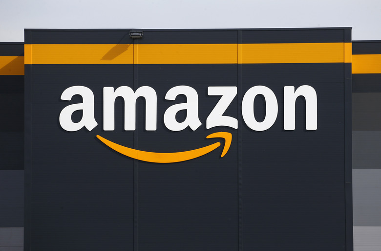 BRETIGNY-SUR-ORGE, FRANCE - APRIL 21: The logo of Amazon is seen on the facade of the company logistics center on April 21, 2020 in Bretigny-sur-Orge, France. The French government has ordered the American e-commerce giant Amazon to take measures at four of its sites in France to better protect employees against Covid-19. This Tuesday, the Versailles Court of Appeal examined the appeal filed by Amazon against a decision requiring it to restrict its activity in France during this period of confinement. Amazon Logistique France has finally decided to close all of its warehouses pending the decision of the Versailles Court of Appeal, which will be made on Friday April 24. The Coronavirus (COVID-19) pandemic has spread to many countries across the world, claiming over 171,000 lives and infecting over 2.5 million people. (Photo by Chesnot/Getty Images)