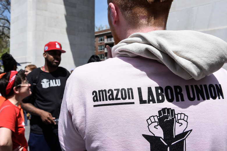 NEW YORK, NY - MAY 01: Amazon workers participate in a May Day rally in Manhattan on May 1, 2022 in New York City. Amazon workers recently unionized a facility in Staten Island called JFK8 emboldening other workers to push for their companies to unionize. (Photo by Stephanie Keith/Getty Images)