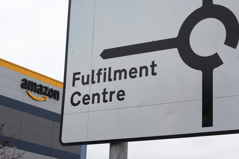 TILBURY, ENGLAND - DECEMBER 16: A road sign shows directions to the Amazon Fulfilment Centre on December 16, 2021 in Tilbury, England. (Photo by John Keeble/Getty Images)