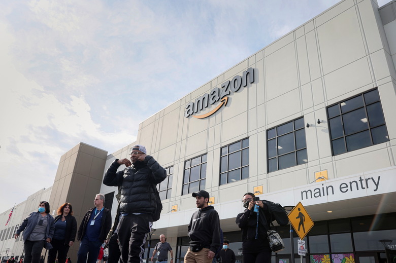 Workers arrive to cast ballots for a union election at Amazon's JFK8 distribution center, in the Staten Island borough of New York City, U.S., March 25, 2022.  REUTERS/Brendan McDermid.