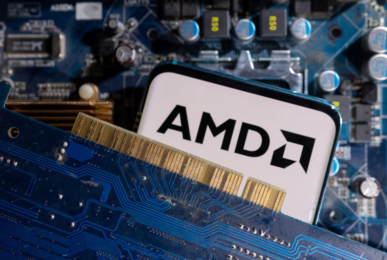 A smartphone with a displayed AMD logo is placed on a computer motherboard in this illustration taken March 6, 2023. REUTERS/Dado Ruvic/Illustration