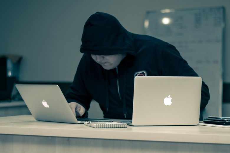 A hooded hacker doing hooded hacker things.
