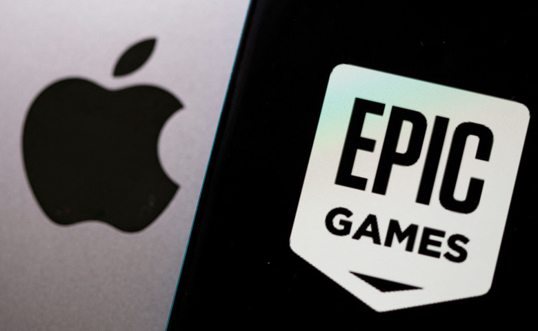 FILE PHOTO: Smartphone with Epic Games logo is seen in front of Apple logo in this illustration taken, May 2, 2021. REUTERS/Dado Ruvic/Illustration/File Photo