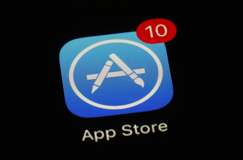 FILE - Apple's App Store icon is displayed on an iPad in Baltimore, March 19, 2018. Apple has unveiled a sweeping plan to tear down some of the competitive barriers that it has built around its lucrative iPhone franchise. The announcement Thursday, Jan. 25, 2024, comes as it moves to comply with upcoming European regulations aimed at giving consumers the choice to use alternative app stores. (AP Photo/Patrick Semansky, File)
