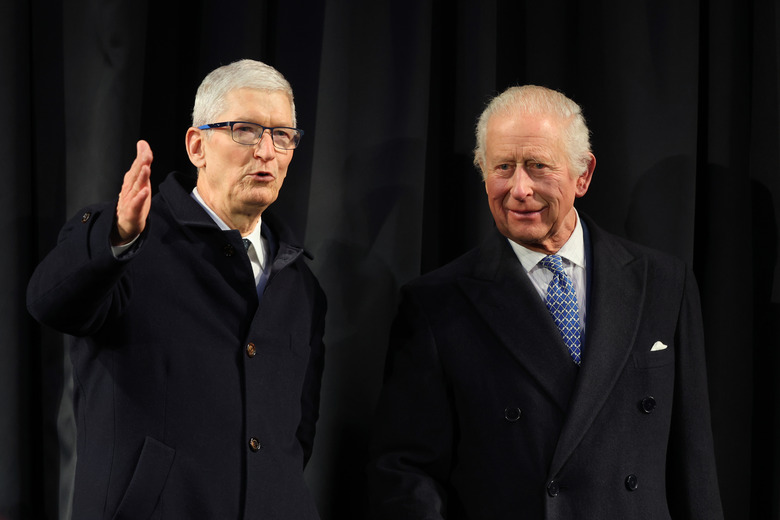 LONDON, ENGLAND - DECEMBER 12: Chief Executive of Apple, Tim Cook and King Charles III  meet Apple employees, community partners and young people from The King’s Trust, during a tour of Apple Headquarters on December 12, 2024 in London, England. The King will engage with Apple employees, learning about their work and contributions to both the tech industry and wider community, before having the opportunity to speak with them about their personal achievements. (Photo by Chris Jackson/Getty Images)
