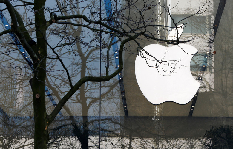 FILE PHOTO: An Apple logo is seen at the entrance of an Apple Store in downtown Brussels, Belgium March 10, 2016.   REUTERS/Yves Herman/File Photo