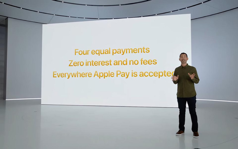 An Apple executive standing in front of a virtual screen with details about Apple Pay Later: 