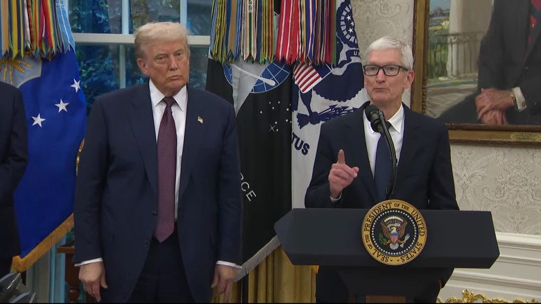 Tim Cook explaining Apple's additional $100 billion investment in US manufacturing alongside President Donald Trump.