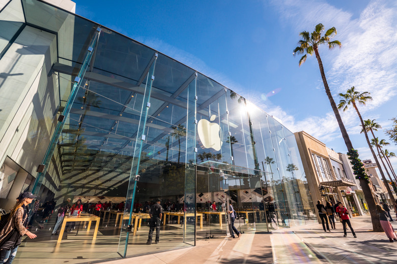 Santa Monica, USA - December 23, 2015: Apple Store on Third Street Promenade with people shopping inside and sightseeing outside on famous shopping street in Santa Monica downtown decorated for Xmas holidays.