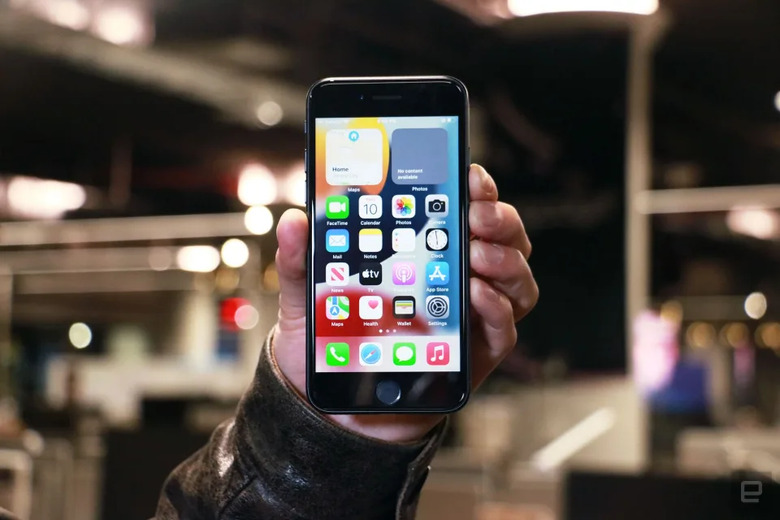 A hand holding a smartphone.