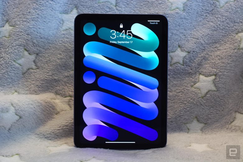 The iPad mini (lock screen) in front of a blanket with stars on it.