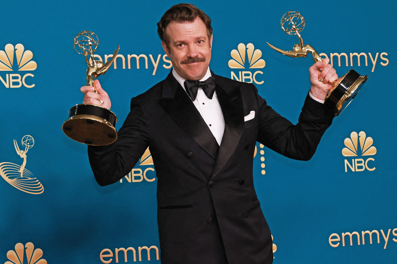 Jason Sudeikis poses with awards for Outstanding Lead Actor in a Comedy Series for 