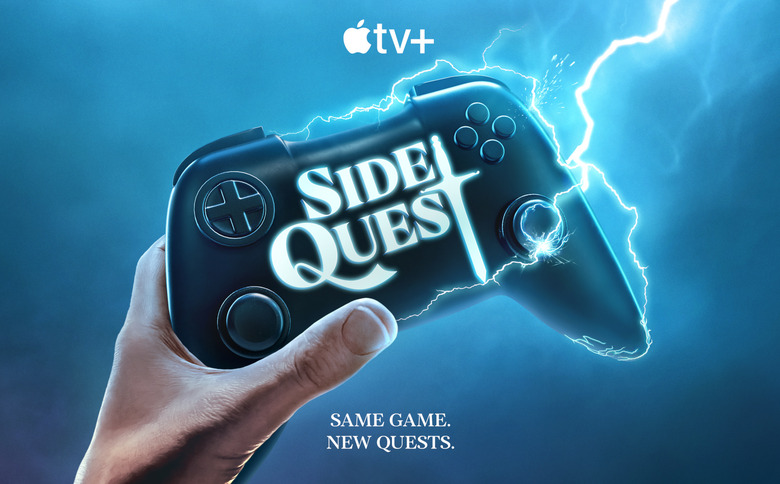 A hand holding a controller.