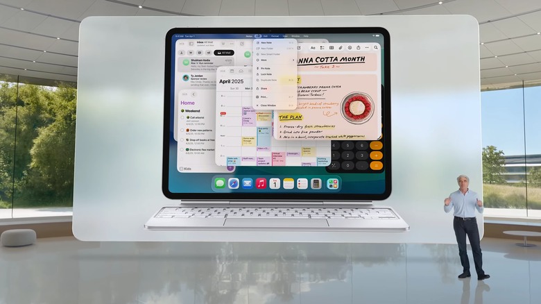 Apple's Craig Federighi standing next to an iPadOS 26 view on an iPad Pro.