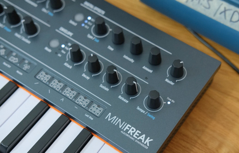 A synthesizer on a desk. 
