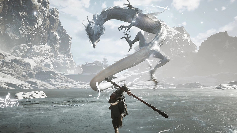 Screen from Black Myth: Wukong, showing the hero charging towards a dragon in a snowy environment.