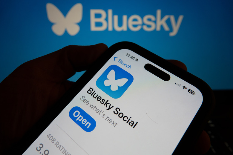BATH, UNITED KINGDOM - NOVEMBER 17: In this photo illustration a smartphone screen displays the logo of social media app Bluesky on November 17, 2024 in Bath, England. Millions of users have been leaving Elon Musk's social media site X, formerly known as Twitter, and have instead been joining Bluesky, set up by former Twitter founder Jack Dorsey. (Photo by Anna Barclay/Getty Images)