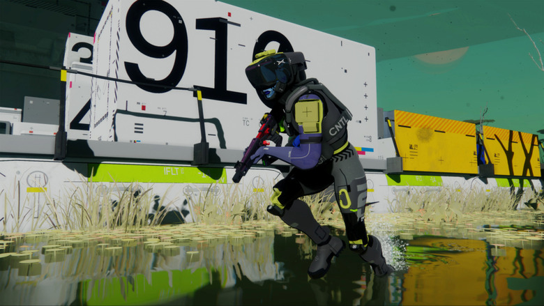 A still from the game Marathon showing a shooter in a helmet and gear trudging through shallow water holding a gun