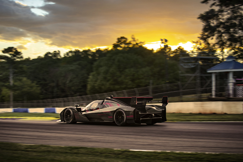 Rear 3/4 view of the Cadillac V-LMDh race car testing on track at Michelin Raceway Road Atlanta.