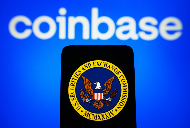 UKRAINE - 2023/06/15: In this photo illustration, U.S. Securities and Exchange Commission (SEC) logo is seen on a smartphone and Coinbase logo on a pc screen. (Photo Illustration by Pavlo Gonchar/SOPA Images/LightRocket via Getty Images)
