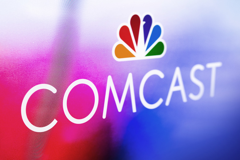 PHILADELPHIA, PA - APRIL 13: In this photo illustration, A Comcast logo is displayed at Comcast Center on April 13, 2021 in Philadelphia, Pennsylvania.  Comcast Corporation will host a conference call with the financial community to discuss financial results for the first quarter on Thursday, April 29, 2021 at 8:30 a.m. Eastern Time (ET). Comcast is a global media and technology company principally focused on broadband, aggregation, and streaming with over 56 million customer relationships across the United States and Europe, through its Xfinity, Comcast Business, and Sky brands. It also creates, distributes, and streams entertainment, sports, and news through Universal Filmed Entertainment Group, Universal Studio Group, Sky Studios, the NBC and Telemundo broadcast networks, multiple cable networks, Peacock, NBCUniversal News Group, NBC Sports, Sky News, and Sky Sports; and provide experiences at Universal Parks and Resorts in the United States and Asia. (Photo by Jeff Fusco/Getty Images for Comcast)
