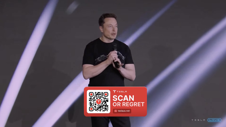 An AI-generated clip of Elon Musk with a qr code that says 