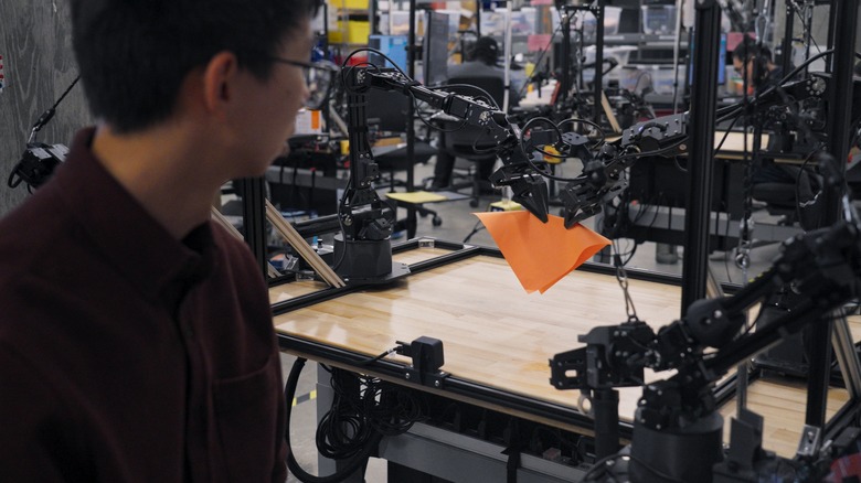 A DeepMind ALOHA 2 robot folds an origami fox