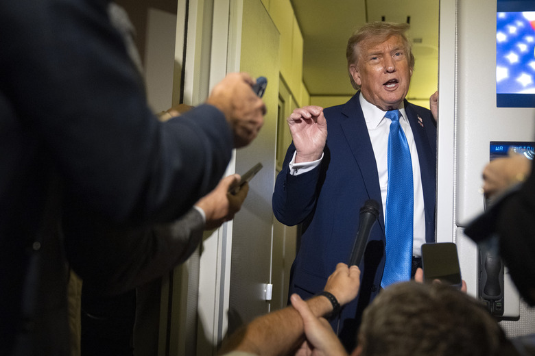 President Donald Trump speaks with reporters while flying aboard Air Force One en route from Calgary, Canada to Joint Base Andrews, Md., late Monday, June 16, 2025. (AP Photo/Mark Schiefelbein)