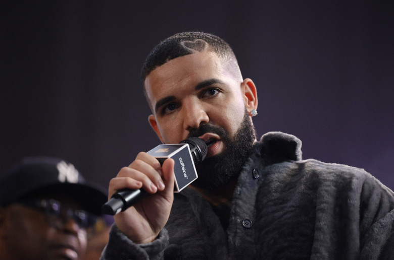 LONG BEACH, CALIFORNIA - OCTOBER 30: Drake speaks  onstage during Drake's Till Death Do Us Part rap battle on October 30, 2021 in Long Beach, California. (Photo by Amy Sussman/Getty Images)