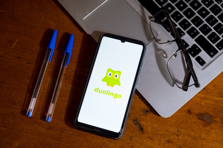 The Duolingo logo is being displayed on a smartphone screen in Athens, Greece, on February 13, 2024. (Photo by Nikolas Kokovlis/NurPhoto via Getty Images)