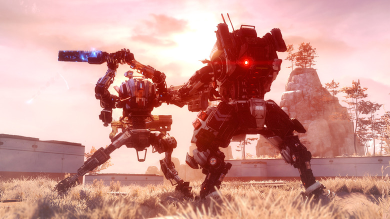 Screen from the game Titanfall 2. Two mechs fighting in a grassy field.