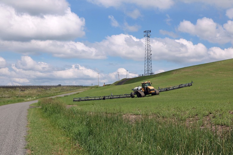 To provide cell phone services in rural areas between larger towns telecommunication companies install towers on hilltops or high ridges in rural areas. This tower is in rural Whitman County Washington adjacent to where a farmer is growing a crop. (Photo by: Don and Melinda Crawford/UCG/Universal Images Group via Getty Images)
