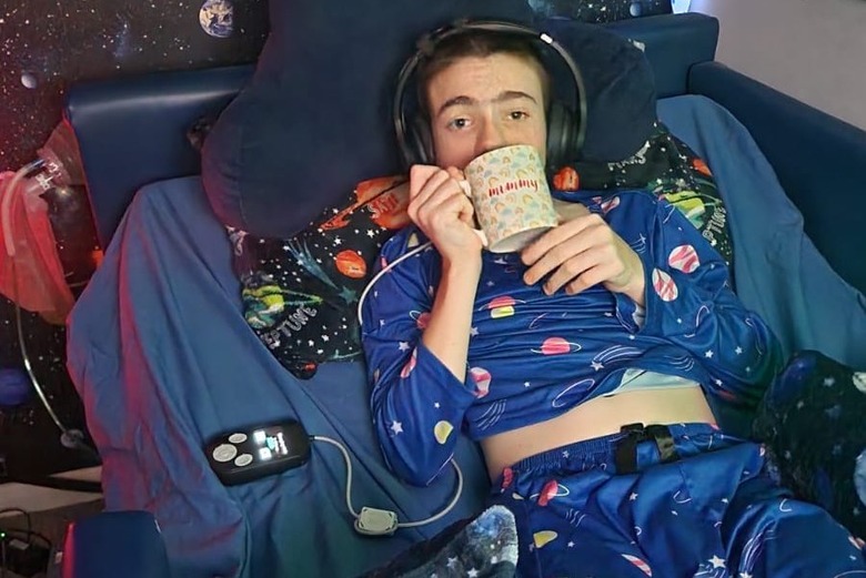 Oran using headphones to charge the Picostim.