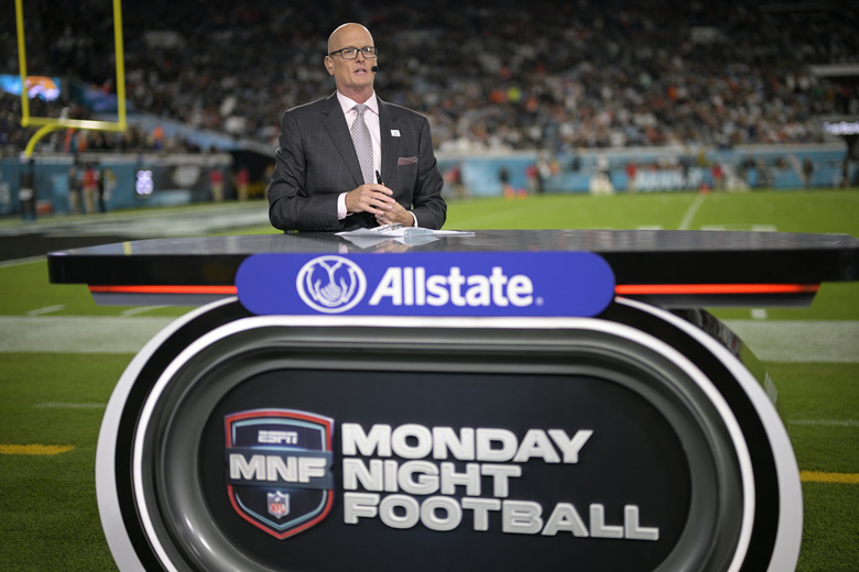 ESPN Monday Night Football host Scott Van Pelt works from the sideline set during halftime of an NFL football game between the Jacksonville Jaguars and the Cincinnati Bengals, Monday, Dec. 4, 2023, in Jacksonville, Fla. (AP Photo/Phelan M. Ebenhack)