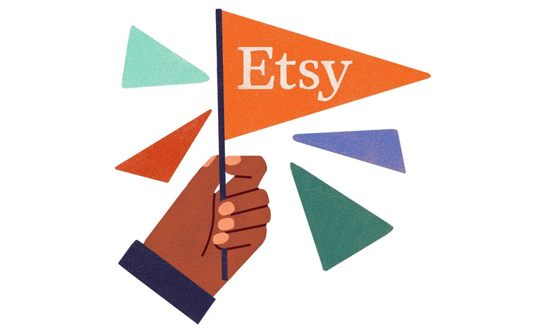Company illustration showing a hand holding an Etsy flag with the company logo on it. Several other colorful triangles float in the air next to it.