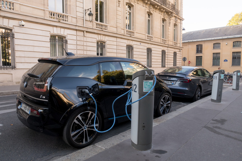 Paris, France - Aug 30, 2019: BMW i3, and a Tesla electric cars charching in Paris, France.