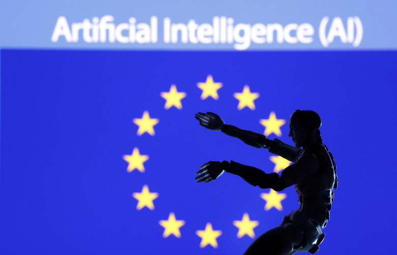 AI Artificial intelligence words, miniature of robot and EU flag are seen in this illustration taken December 21, 2023. REUTERS/Dado Ruvic/Illustration/File Photo
