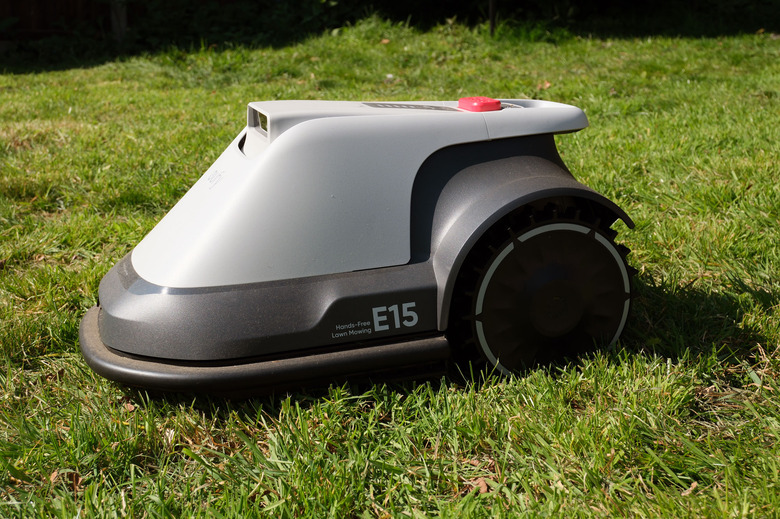 Image of the Eufy E15 robot mower on a lawn.