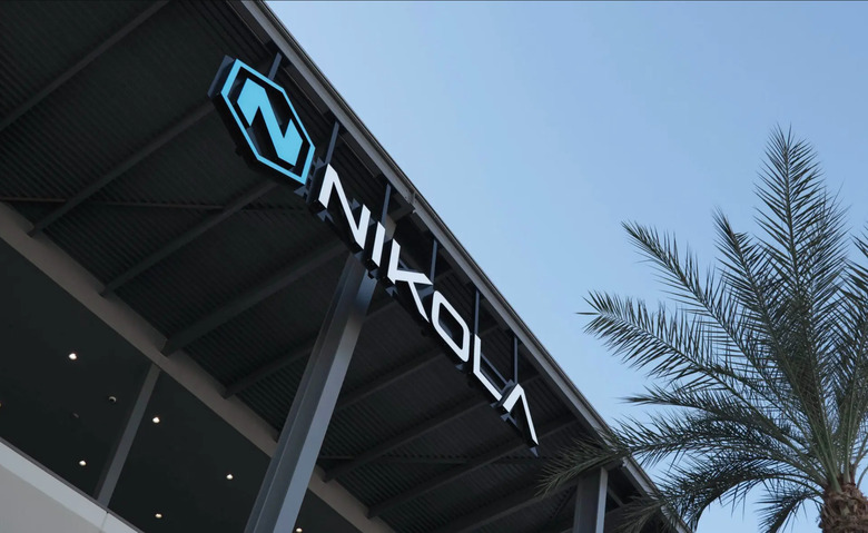 Nikola signage with a palm tree.